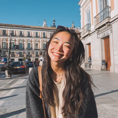 Smiling in a sunny European plaza
